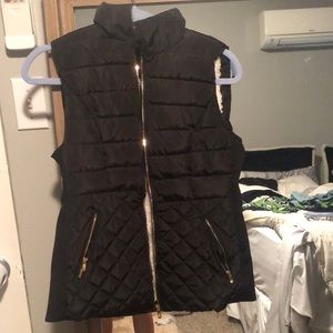 Black vest with gold zippers
